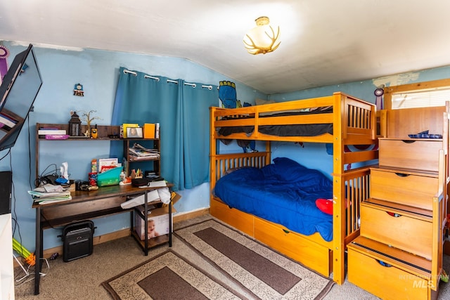 carpeted bedroom featuring vaulted ceiling