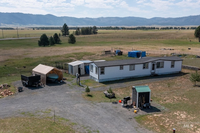 bird's eye view featuring a rural view and a mountain view