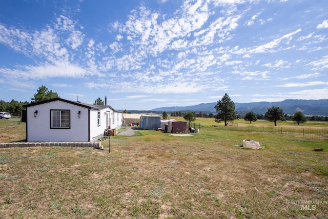 view of yard featuring a mountain view and a rural view