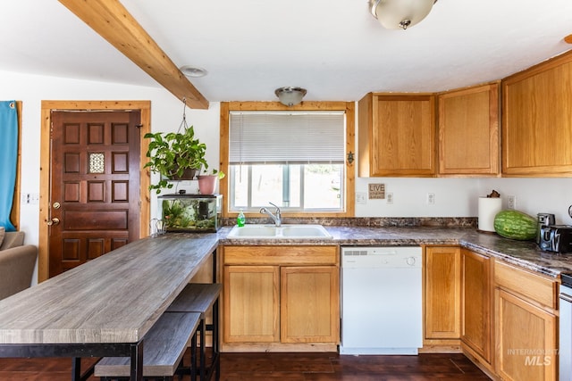 kitchen with dark wood-type flooring, beam ceiling, sink, and white dishwasher