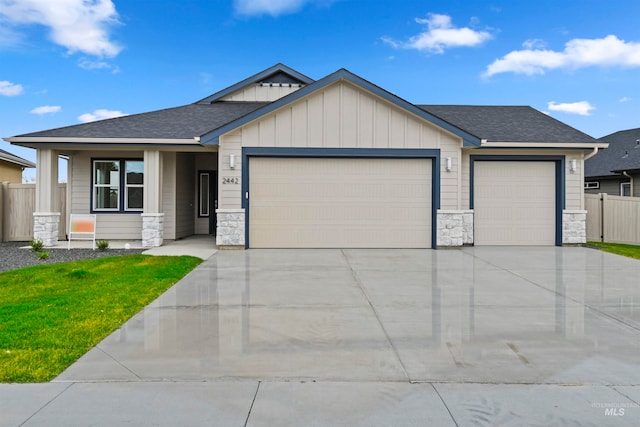 view of front facade featuring a front yard and a garage