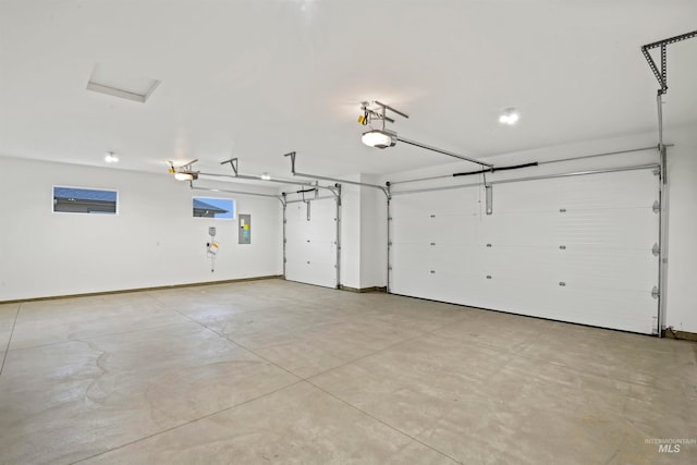 garage featuring a garage door opener and electric panel