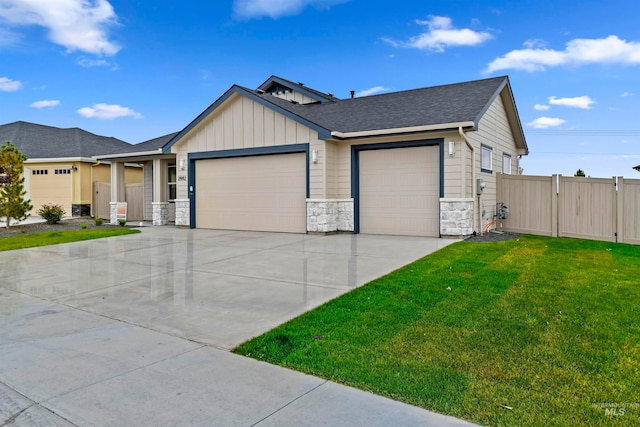 view of front of home featuring a front lawn and a garage