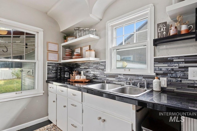 176 Taylor St, Twin Falls, ID 83301 - kitchen with a sink, dark countertops, tasteful backsplash, open shelves, and white cabinets