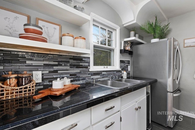 176 Taylor St, Twin Falls, ID 83301 - kitchen with a sink, open shelves, white cabinets, freestanding refrigerator, and backsplash