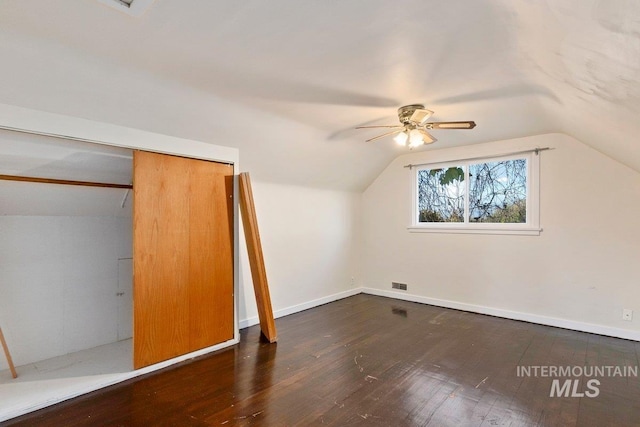 bonus room featuring ceiling fan, lofted ceiling, and dark hardwood / wood-style floors