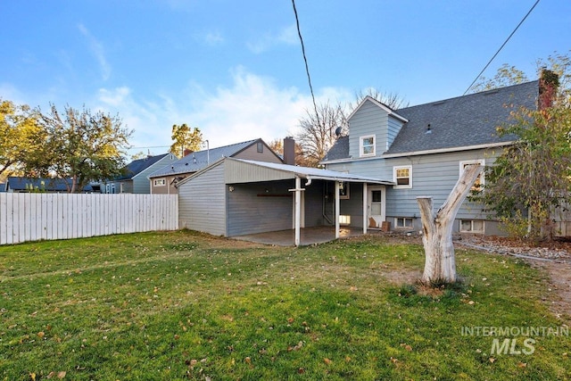176 Taylor St, Twin Falls, ID 83301 - rear view of house with a patio area, a chimney, and a shingled roof