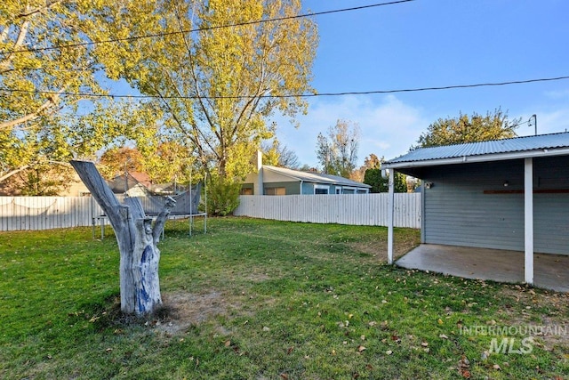 view of yard with a patio and a trampoline