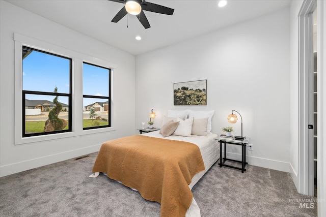 carpeted bedroom with ceiling fan