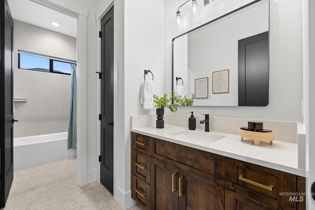 bathroom with vanity and shower / bath combo