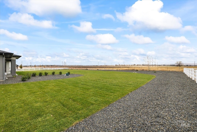 view of yard with a rural view