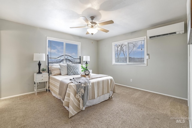 carpeted bedroom featuring a wall mounted AC and ceiling fan