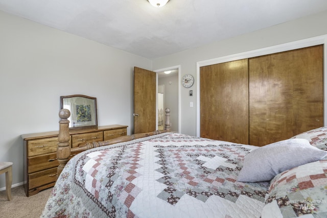 bedroom with light carpet and a closet