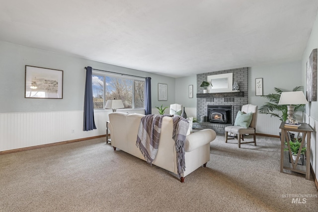 living room featuring a brick fireplace and light carpet