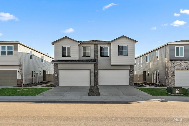 view of front of house with stone siding, cooling unit, driveway, and a garage