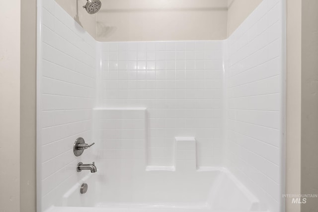 interior details with shower / bathtub combination