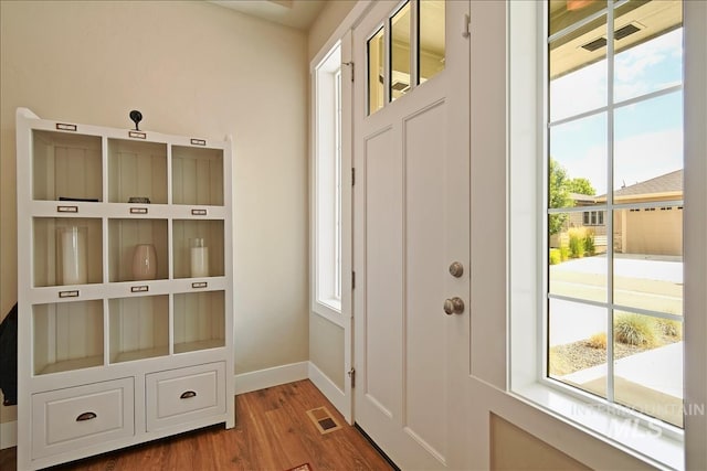 3998 W Caragana Ct, Meridian, ID 83646 - mudroom featuring visible vents, baseboards, plenty of natural light, and wood finished floors
