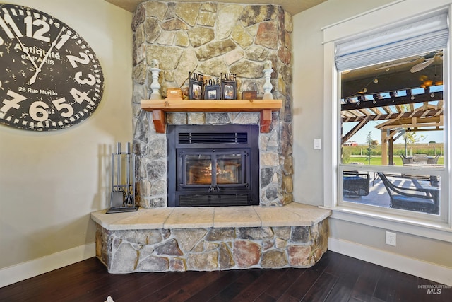 details featuring wood finished floors and baseboards