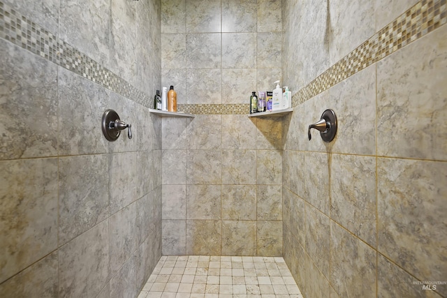 full bath with a tile shower