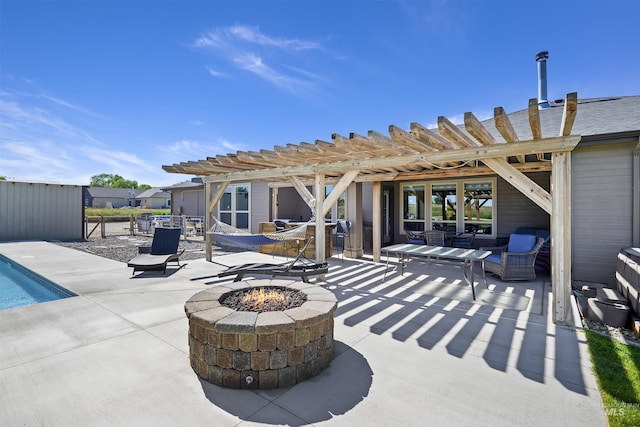 view of patio / terrace featuring an outdoor fire pit, an outdoor pool, and a pergola