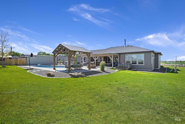 rear view of property with a lawn, a gazebo, a patio area, fence, and a pergola