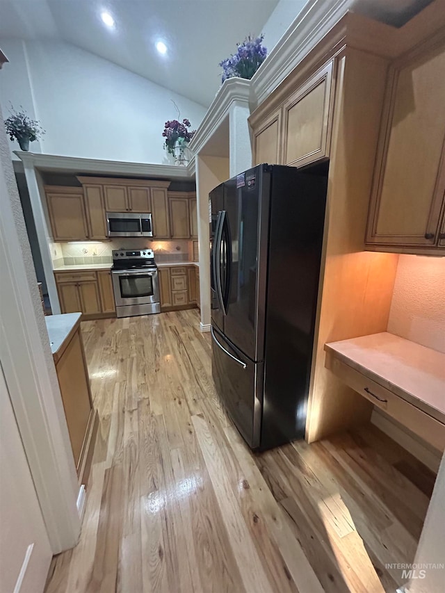 kitchen featuring stainless steel appliances and light wood-type flooring