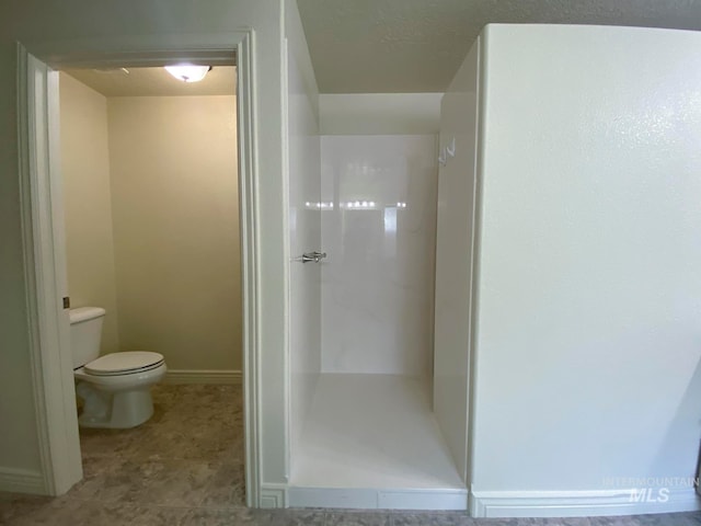 bathroom with tile patterned floors and toilet