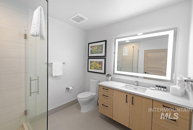 720 Village Dr Unit 404, Donnelly, ID 83615 - full bathroom with vanity, toilet, a stall shower, and tile patterned floors