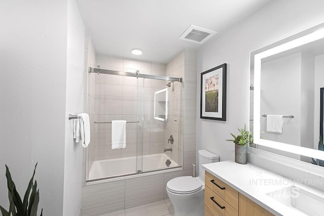 720 Village Dr Unit 404, Donnelly, ID 83615 - bathroom featuring shower / bath combination with glass door, toilet, vanity, and tile patterned floors