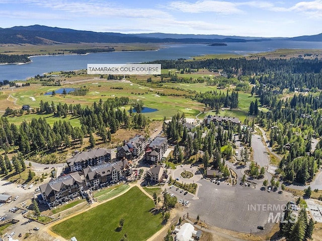 720 Village Dr Unit 404, Donnelly, ID 83615 - aerial view of property and surrounding area featuring a water and mountain view