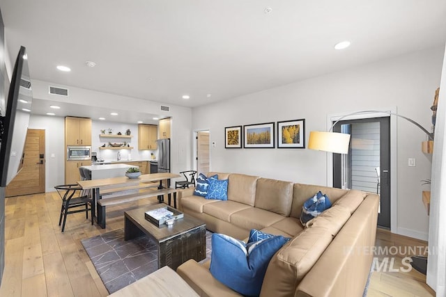 720 Village Dr Unit 404, Donnelly, ID 83615 - living area featuring light wood-style flooring and recessed lighting
