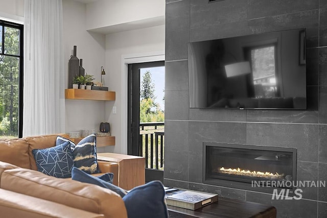720 Village Dr Unit 404, Donnelly, ID 83615 - living area featuring healthy amount of natural light and a tile fireplace
