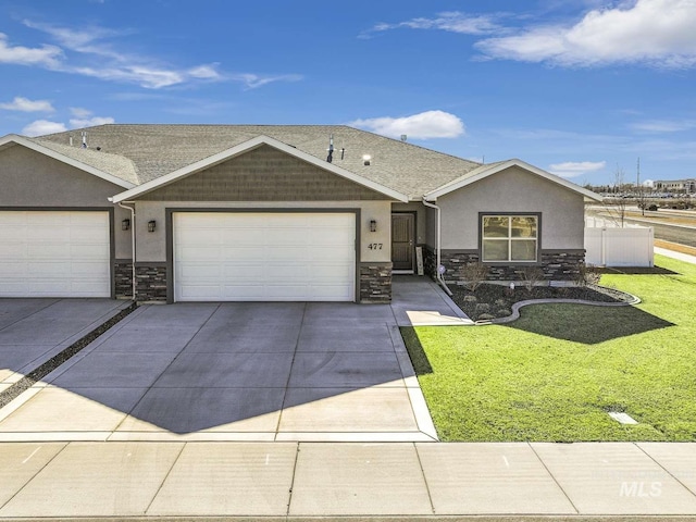 view of front facade featuring stone siding, stucco siding, concrete driveway, and a front lawn