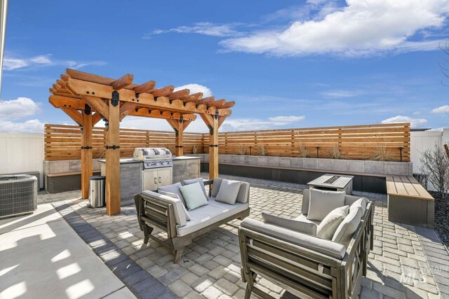 view of patio / terrace with an outdoor kitchen, outdoor lounge area, a fenced backyard, central AC unit, and grilling area