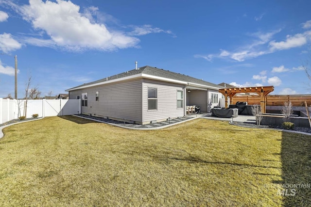 back of house with a jacuzzi, a pergola, and a patio