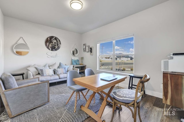 office space featuring wood finished floors and baseboards