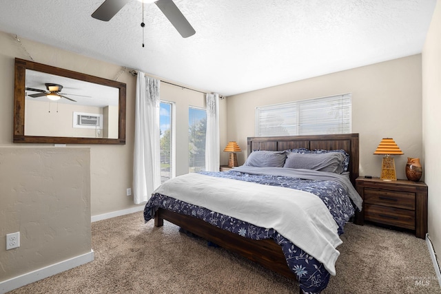 carpeted bedroom featuring baseboards, a textured ceiling, ceiling fan, and access to exterior