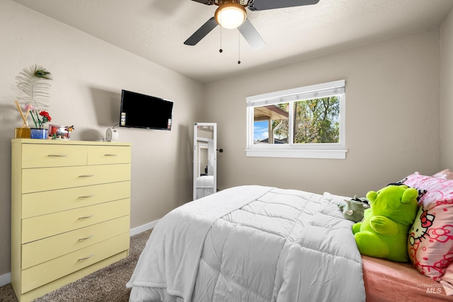 bedroom with baseboards, a ceiling fan, and carpet flooring