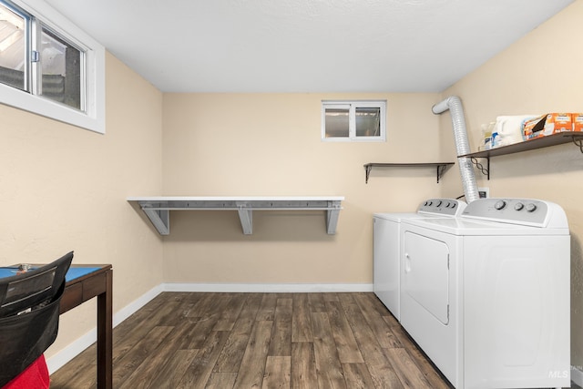 washroom featuring baseboards, laundry area, dark wood-style flooring, and washer and clothes dryer