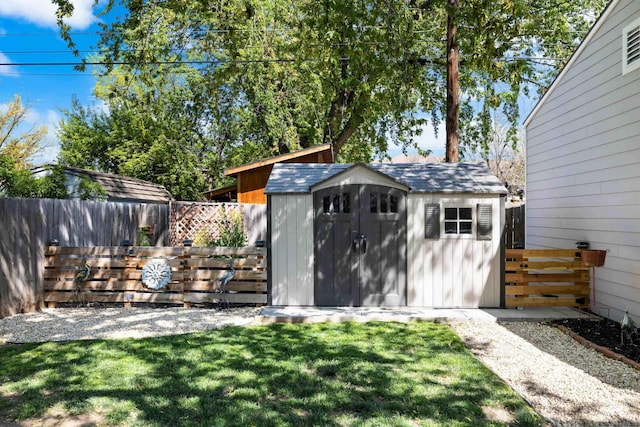 view of shed featuring a fenced backyard