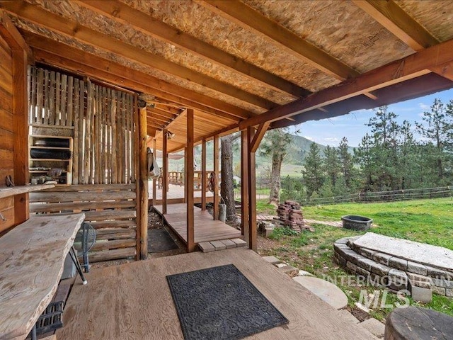 view of patio with an outbuilding and an exterior structure