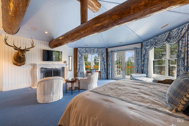 4305 Song Sparrow Ct, Mccall, ID 83638 - bedroom with access to outside, beam ceiling, carpet floors, and a fireplace
