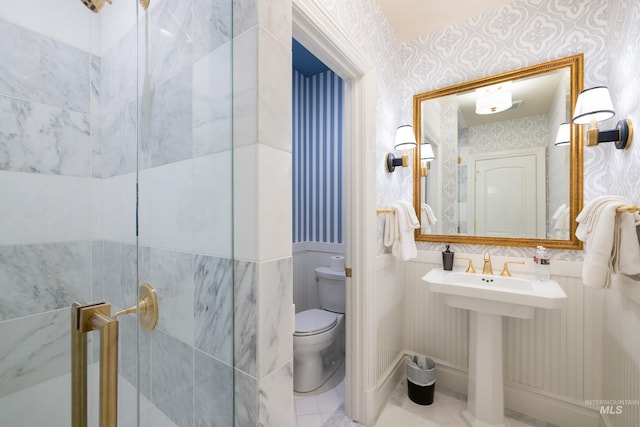 4305 Song Sparrow Ct, Mccall, ID 83638 - bathroom with wallpapered walls, toilet, a shower stall, and tile patterned floors