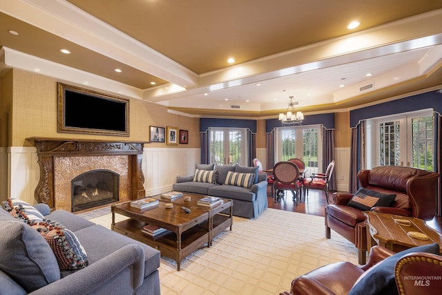 4305 Song Sparrow Ct, Mccall, ID 83638 - living room with wainscoting, a decorative wall, a chandelier, recessed lighting, and a premium fireplace