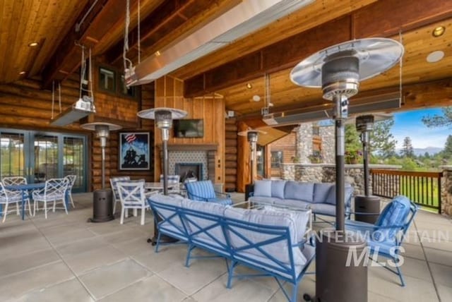 4305 Song Sparrow Ct, Mccall, ID 83638 - view of patio / terrace featuring an outdoor living space with a fireplace, outdoor dining area, and french doors
