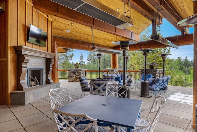 4305 Song Sparrow Ct, Mccall, ID 83638 - view of patio with outdoor dining area and an outdoor living space with a fireplace
