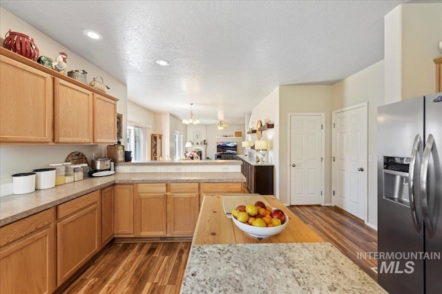 2175 W Willow Pointe Ave, Nampa, ID 83651 - kitchen featuring stainless steel fridge with ice dispenser, a chandelier, light countertops, dark wood-type flooring, and a textured ceiling