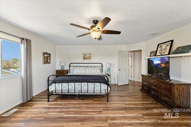 2175 W Willow Pointe Ave, Nampa, ID 83651 - bedroom with wood finished floors, a textured ceiling, ceiling fan, and baseboards