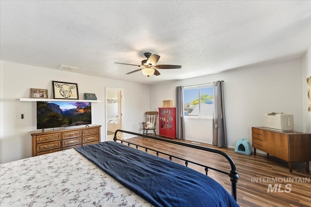 2175 W Willow Pointe Ave, Nampa, ID 83651 - bedroom with wood finished floors, a textured ceiling, ensuite bath, and ceiling fan