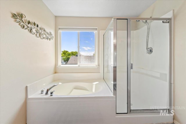 2175 W Willow Pointe Ave, Nampa, ID 83651 - bathroom featuring a stall shower and a garden tub